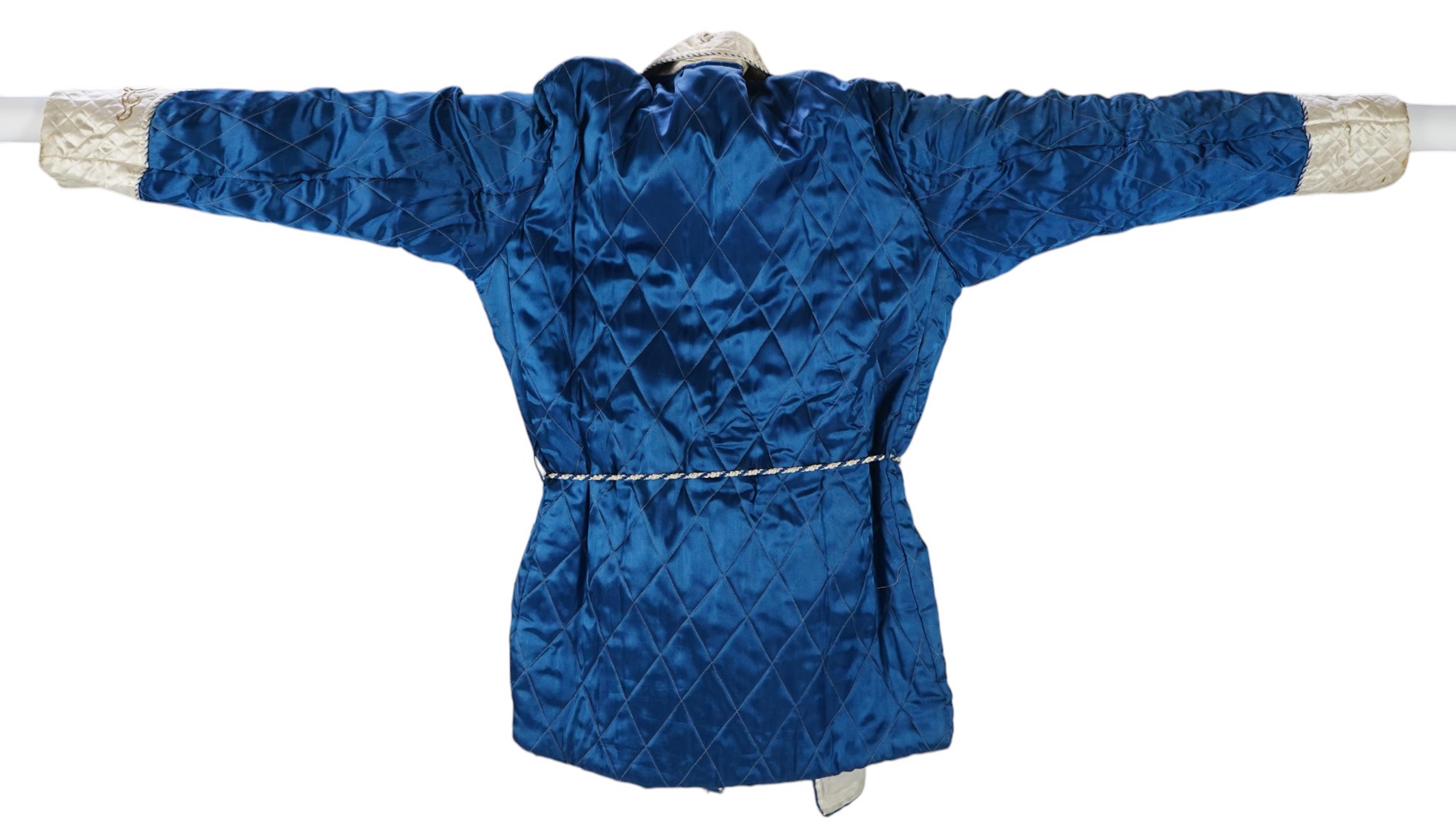 A mid 20th century Royal blue satin gentleman’s smoking jacket and matching dressing gown with Chinese gold dragon embroidery to both the quilted collars and cuffs, measurement from top back of collar to bottom of dressi